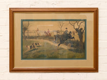 Load image into Gallery viewer, Vintage framed English fox hunting scene with riders on horseback and hounds in a pastoral countryside landscape
