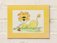 Load image into Gallery viewer, Vintage Hildi illustration of a whimsical yellow lion with orange mane, curled tail, flowers, and yellow border
