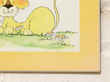 Load image into Gallery viewer, A close-up of a framed or mounted art print showing a cartoon lion tail, flowers, and green grass on a pale background, with a yellow border around the print.
