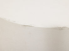 Load image into Gallery viewer, Close-up of a textured off-white canvas or fabric surface with a curved edge and fine woven detail.
