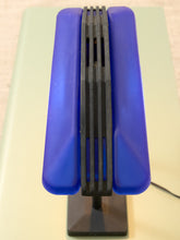 Load image into Gallery viewer, A vintage-style blue and black vented light fixture or lampshade on a stand, photographed from a top-down angle on a pale green surface.
