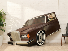 Load image into Gallery viewer, Oversized humorous luxury car photo prop with large silver grille, burgundy body, whitewall tires, and faux driver behind the wheel.
