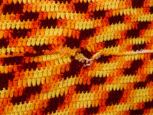 Load image into Gallery viewer, Close-up of a textured woven textile with horizontal stripes in orange, yellow, and dark red/burgundy.
