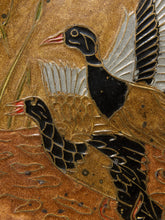Load image into Gallery viewer, Close-up of a decorative wall art piece showing two stylized ducks in flight on a textured gold and brown background.
