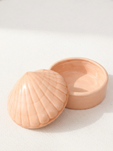 Load image into Gallery viewer, A small shell-shaped ceramic box with its lid leaning against the open base, shown on a light textured background.
