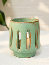 Load image into Gallery viewer, Vintage celadon green glazed studio pottery vessel with elongated carved oval openings
