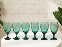 Load image into Gallery viewer, Set of six vintage emerald green stemmed drinking glasses with rounded bowls and circular bases
