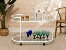 Load image into Gallery viewer, Vintage white tubular metal outdoor bar cart with two smoked glass shelves and casters
