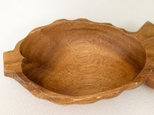 Load image into Gallery viewer, A handcrafted wooden bowl with a scalloped edge and a small handle on the right side, shown on a light beige textured fabric background.
