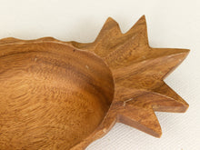 Load image into Gallery viewer, Close-up of a wooden spoon or small dish with a starburst-shaped handle and a smooth curved bowl, showing natural wood grain on a light off-white background.
