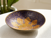 Load image into Gallery viewer, Vintage enamel bowl with orange gold floral design and ornate patterns on deep cobalt blue ground
