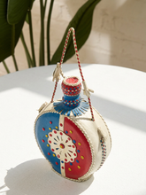 Load image into Gallery viewer, Vintage round leather-wrapped decanter with red blue and cream hand-stitched geometric decoration
