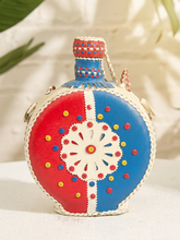 Load image into Gallery viewer, Vintage round leather-wrapped decanter with red blue and cream hand-stitched geometric decoration
