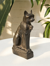 Load image into Gallery viewer, Black Egyptian Revival Bastet-inspired seated cat sculpture with decorative collar and rectangular base

