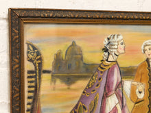 Load image into Gallery viewer, A close-up of an ornate framed painting showing two figures in historical clothing against a warm sunset sky, with a domed building in the background. The frame is dark wood with gold detailing, and the wall behind it is white textured plaster.
