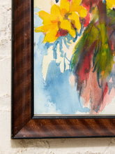 Load image into Gallery viewer, A close-up of a framed watercolor painting showing yellow flowers with green and red brushstrokes on a light background, set in a dark brown wooden frame against a white textured wall.
