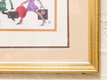 Load image into Gallery viewer, A close-up of a framed art print showing the lower portion of a vintage-style illustration of women carrying shopping bags, with a wide beige mat and a textured gold frame against a white wall.
