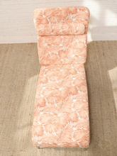 Load image into Gallery viewer, Vintage chaise lounge with peach and cream palm leaf upholstery, rounded back, and matching bolster cushion
