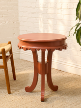 Load image into Gallery viewer, Vintage 1970s tangerine orange round side table with layered top, scalloped apron, and curved legs
