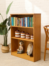 Load image into Gallery viewer, Vintage light wood bookcase with three open shelf levels, natural wood grain, and compact rectangular silhouette
