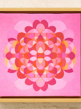 Load image into Gallery viewer, A square framed art print featuring a vibrant pink and red geometric mandala design, set in a light wood frame against a neutral textured wall.
