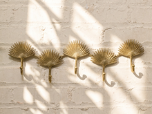 Load image into Gallery viewer, Vintage brass-tone wall hook rack with connected fan-shaped motifs and curved clothing hooks

