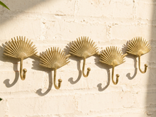 Load image into Gallery viewer, Vintage brass-tone wall hook rack with connected fan-shaped motifs and curved clothing hooks

