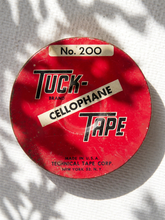 Load image into Gallery viewer, Vintage red Tuck Tape No. 200 cellophane tape round container with black and white advertising graphics
