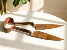 Load image into Gallery viewer, Antique primitive metal sheep shears with tapered blades, spring handles, and heavily aged rusted patina
