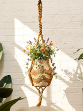 Load image into Gallery viewer, Vintage 1970s natural fiber macramé plant hanger with braided knots, twisted cord details, and tassel

