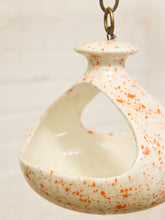Load image into Gallery viewer, Vintage ceramic hanging bird feeder with cream glaze, orange-red speckles, open feeding area, and metal chain
