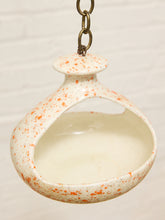 Load image into Gallery viewer, Vintage ceramic hanging bird feeder with cream glaze, orange-red speckles, open feeding area, and metal chain
