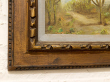 Load image into Gallery viewer, Vintage framed desert landscape painting with saguaro cacti, mountain backdrop, blue sky, and carved wood frame
