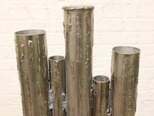 Load image into Gallery viewer, Brutalist welded steel sculpture with vertical tubular pipes of varying heights on a square metal base
