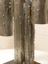 Load image into Gallery viewer, Brutalist welded steel sculpture with vertical tubular pipes of varying heights on a square metal base
