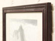 Load image into Gallery viewer, Close-up of a dark reddish-brown wooden picture frame with a white mat and a soft-focus gray and white art print, mounted on a textured off-white wall.

