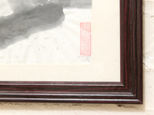 Load image into Gallery viewer, Close-up of a framed art print showing a dark reddish-brown wooden frame, cream matting, a black ink wash, and a red seal on textured paper.
