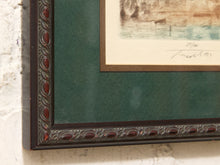 Load image into Gallery viewer, Close-up of a framed art print showing a dark brown ornate frame, deep green matting, and part of a sepia-toned illustration on cream paper.
