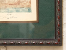 Load image into Gallery viewer, Close-up of a framed artwork showing part of a print with a cream paper border, blue watercolor area, dark green mat, and an ornate dark brown carved wooden frame.
