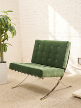 Load image into Gallery viewer, Vintage Barcelona-style lounge chair with olive green button-tufted seat and back, polished metal frame, and support straps
