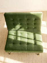 Load image into Gallery viewer, Vintage Barcelona-style lounge chair with olive green button-tufted seat and back, polished metal frame, and support straps
