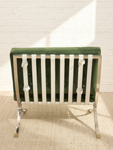 Load image into Gallery viewer, Vintage Barcelona-style lounge chair with olive green button-tufted seat and back, polished metal frame, and support straps

