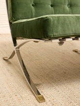 Load image into Gallery viewer, Vintage Barcelona-style lounge chair with olive green button-tufted seat and back, polished metal frame, and support straps
