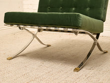 Load image into Gallery viewer, Vintage Barcelona-style lounge chair with olive green button-tufted seat and back, polished metal frame, and support straps
