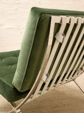 Load image into Gallery viewer, Vintage Barcelona-style lounge chair with olive green button-tufted seat and back, polished metal frame, and support straps
