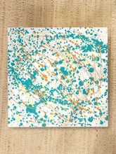 Load image into Gallery viewer, Vintage square side table with abstract green, orange, and yellow splatter-painted top and dark curved-leg base
