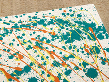 Load image into Gallery viewer, Vintage square side table with abstract green, orange, and yellow splatter-painted top and dark curved-leg base
