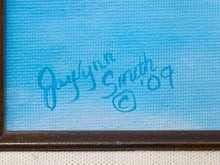 Load image into Gallery viewer, Close-up of a framed artwork showing a textured light blue painted surface with a blue signature reading 'Gayluna Smith 2009' and a dark brown frame edge visible at the bottom.
