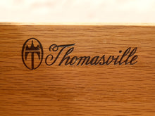 Load image into Gallery viewer, Close-up of a wooden surface engraved with the Thomasville logo and script name.
