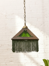 Load image into Gallery viewer, Vintage pyramid hanging pendant lamp with triangular textured green glass panels, aged metal frame, brass-tone chain, and fringe trim

